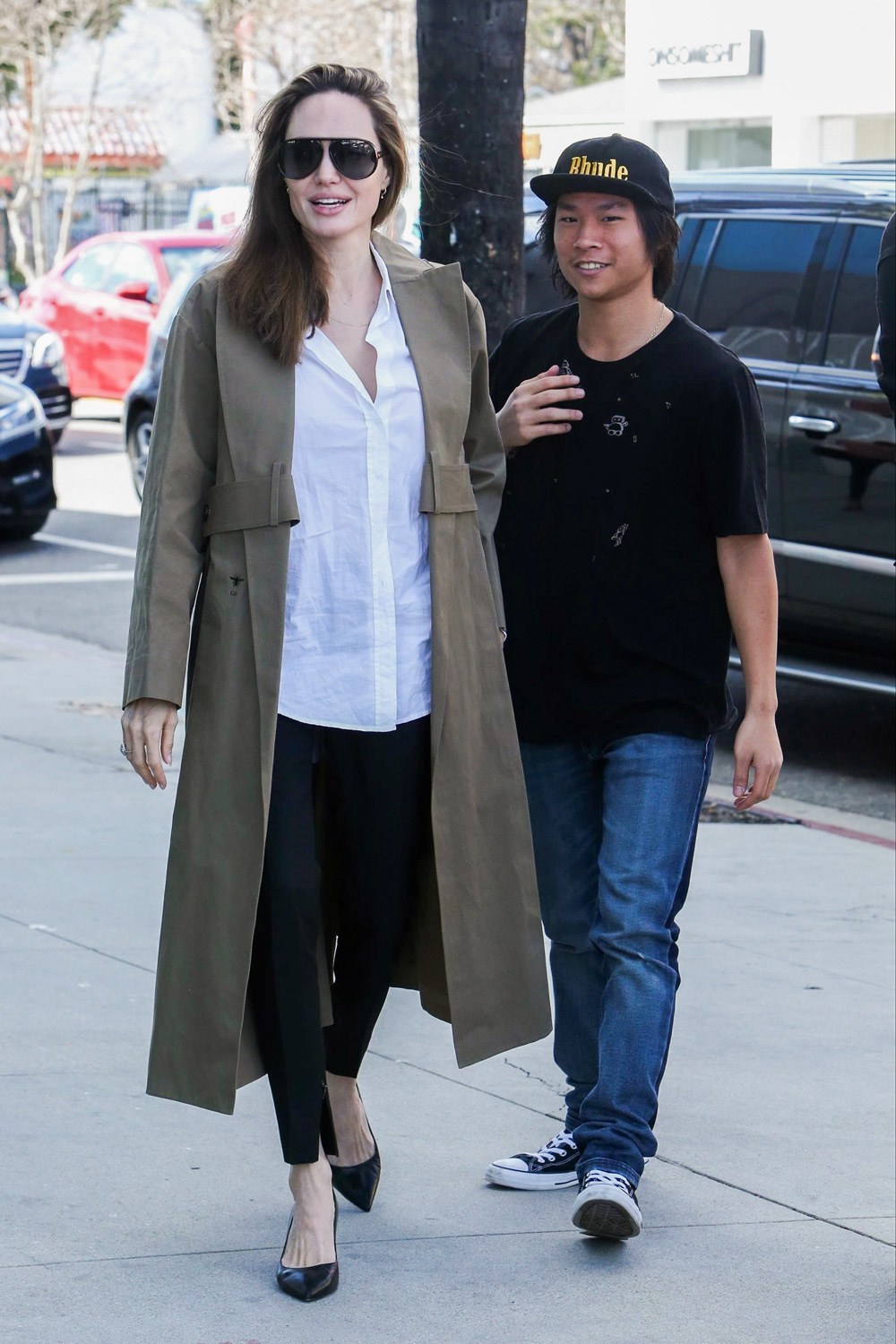 angelina jolie all smiles while shopping with pax after brad pitt jennifer aniston reunite at her birthday party 01